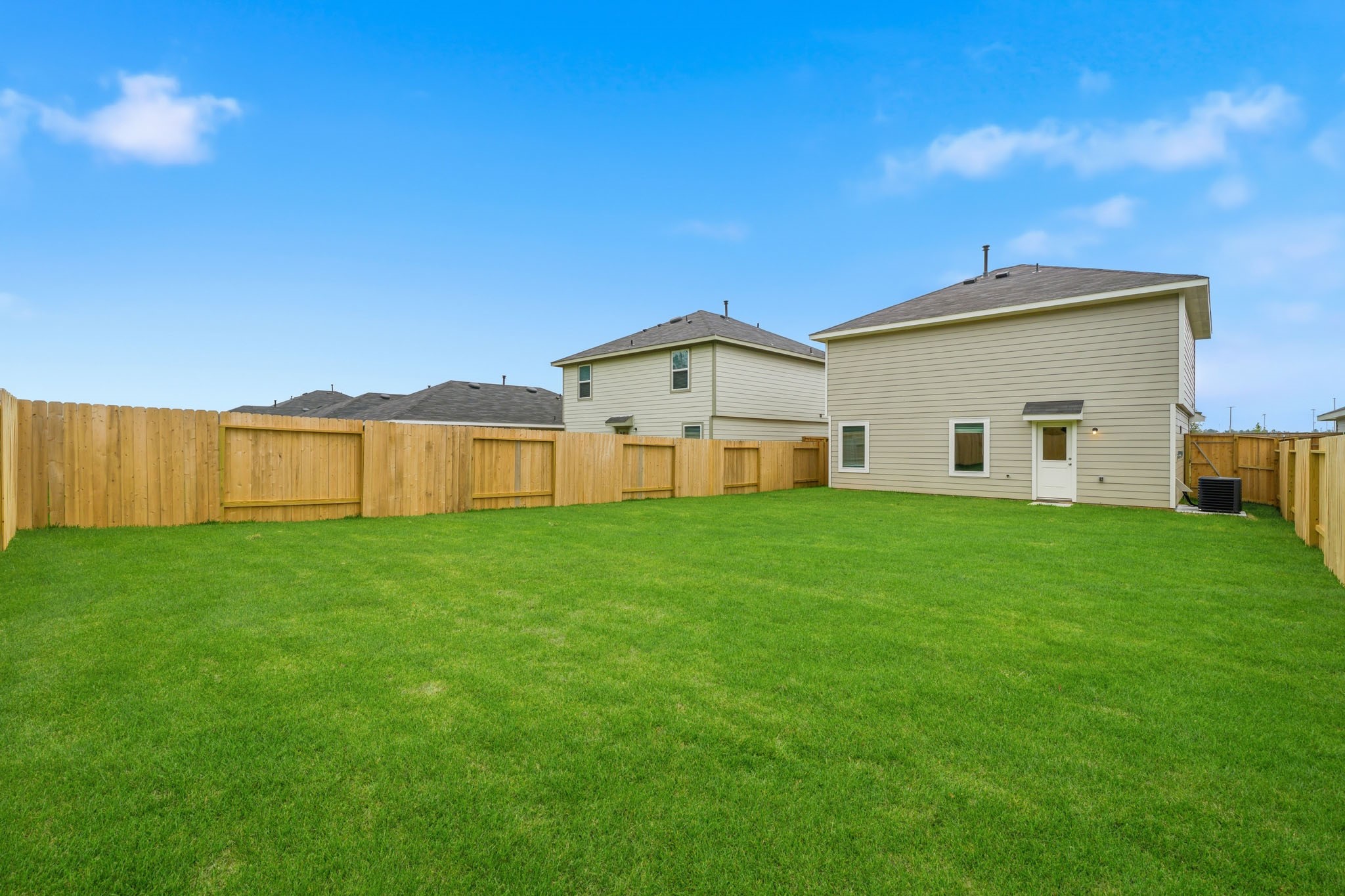 14357 Tawny Street Splendora, TX 77372 - Photo 20 of 28 a view of a house with backyard