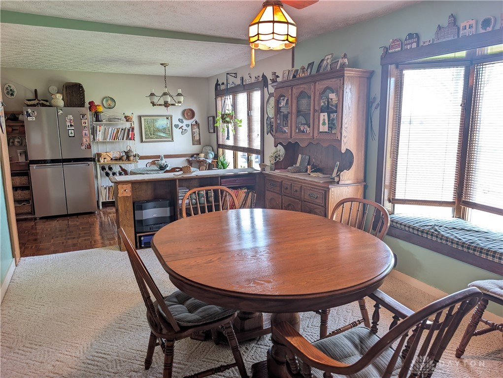 8713 Oakes Road Arcanum, OH 45304 - Photo 17 of 29 This inviting dining area features a large window with a built-in seating bench.