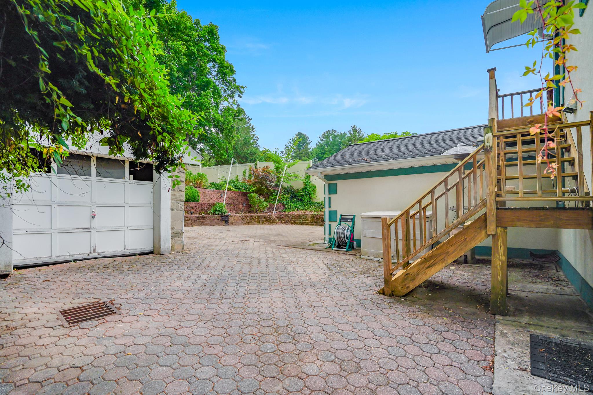 211 Pomeroy Street Peekskill, NY 10566 - Photo 33 of 50 Showing staircase with access to second floor from the patio