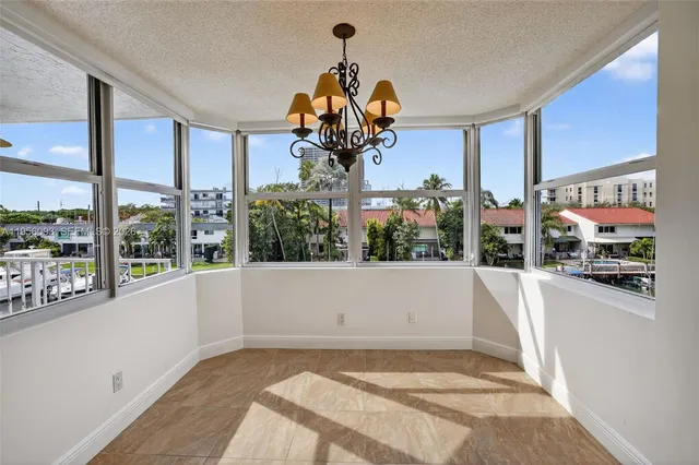a view of a house with wooden floor and a lake view