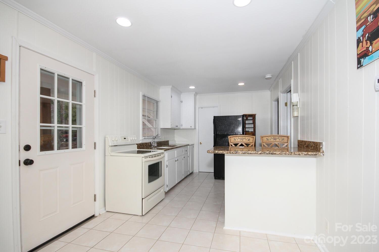 5615 Cypress Road Clover, SC 29710 - Photo 12 of 26 a kitchen with a stove a sink and a refrigerator