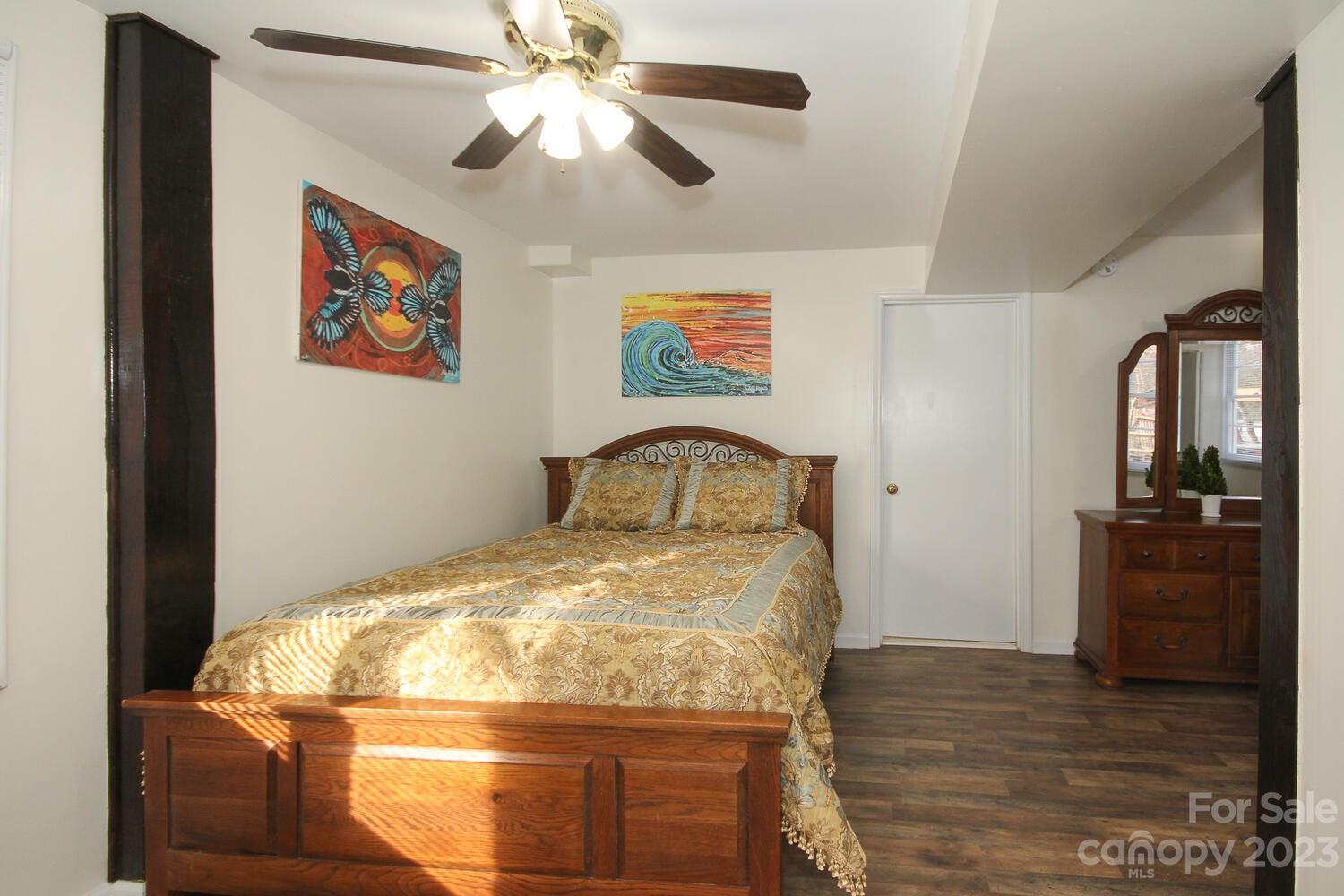 5615 Cypress Road Clover, SC 29710 - Photo 17 of 26 a bed sitting in a bedroom next to a window with pc on the wall