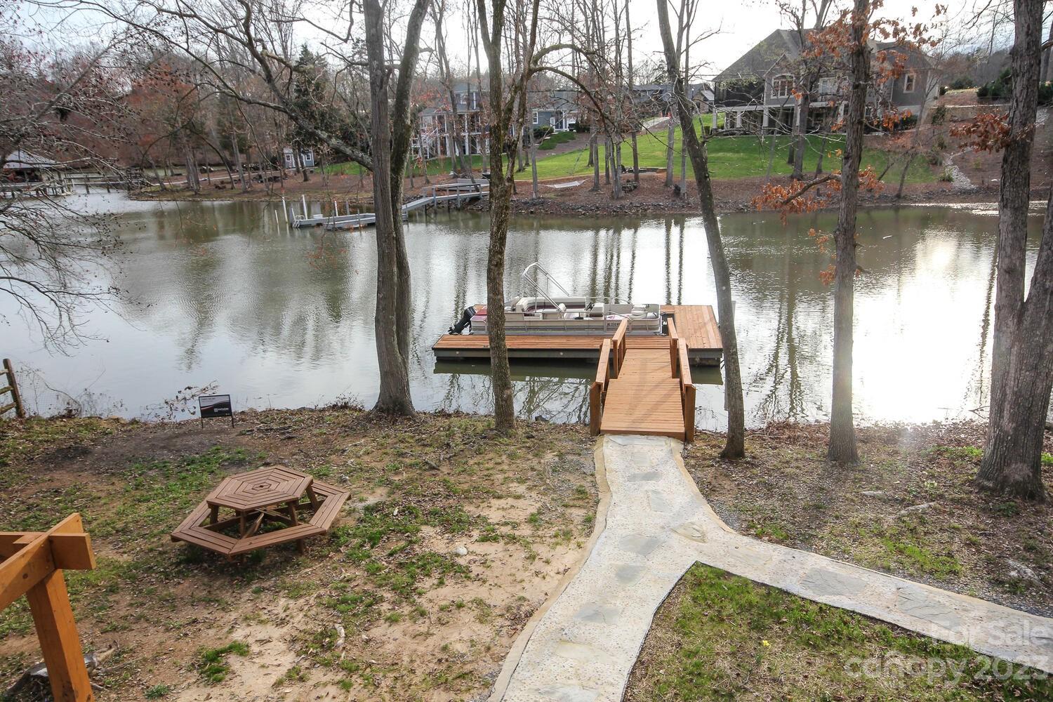 5615 Cypress Road Clover, SC 29710 - Photo 5 of 26 a swimming pool with some trees in the background