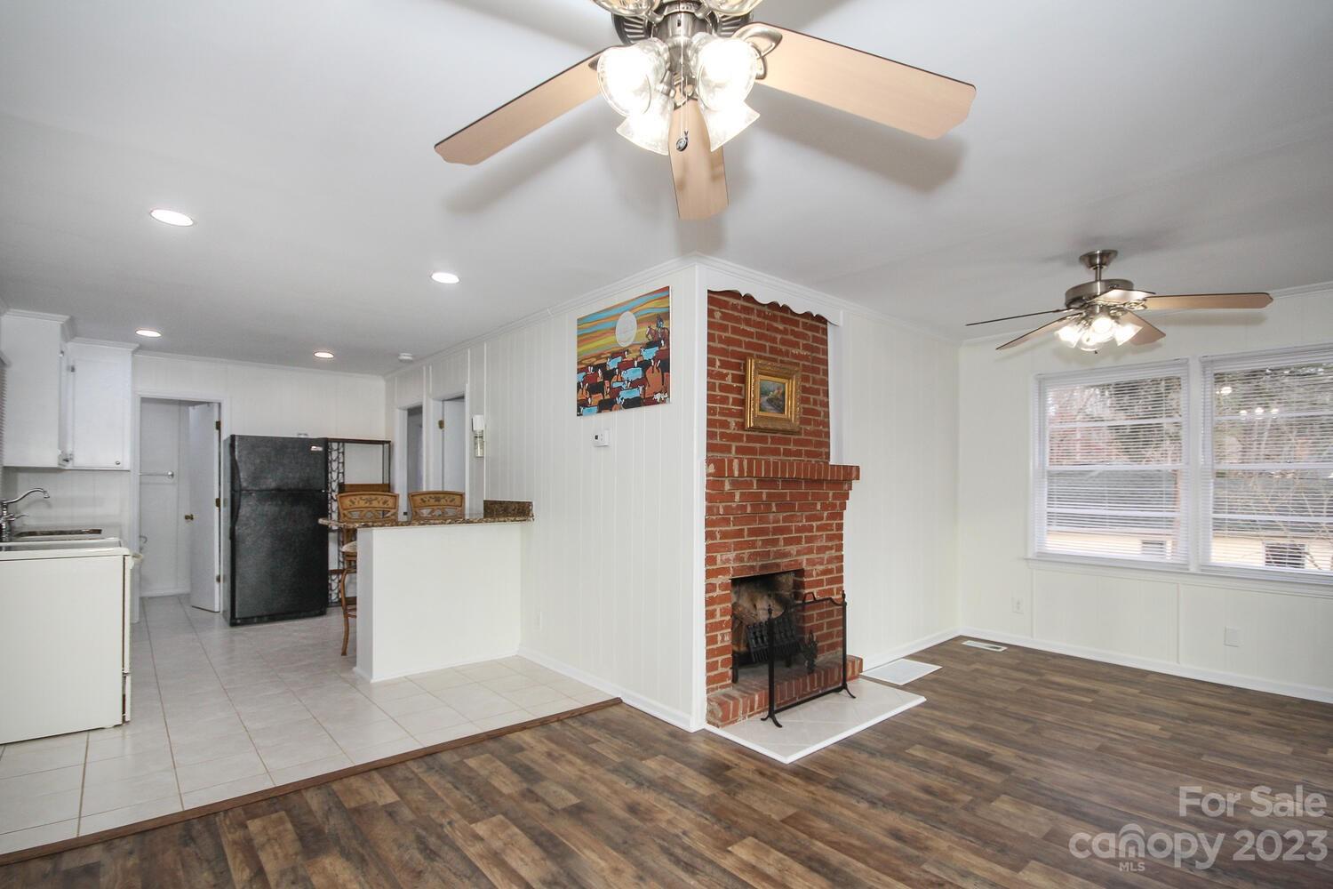 5615 Cypress Road Clover, SC 29710 - Photo 10 of 26 a view of a kitchen with a stove cabinets a refrigerator and wooden floor