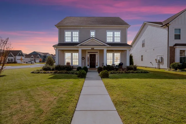 a front view of a house with yard