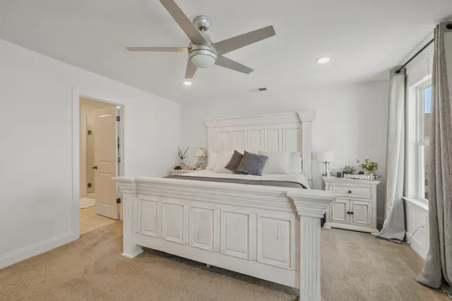 a spacious bathroom with a double vanity sink and a mirror