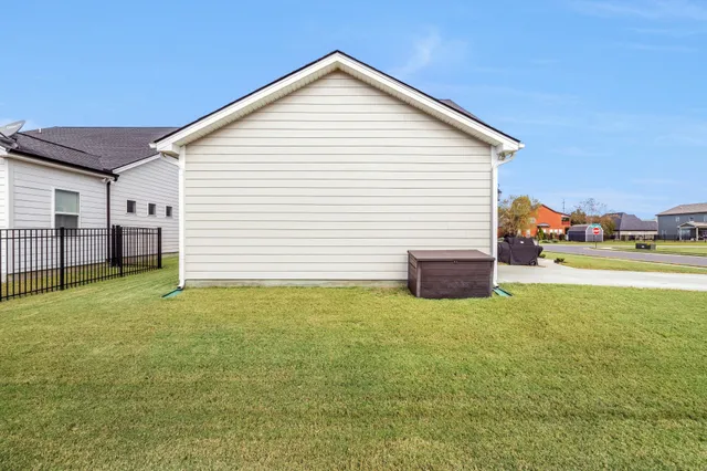 a view of a house with a backyard