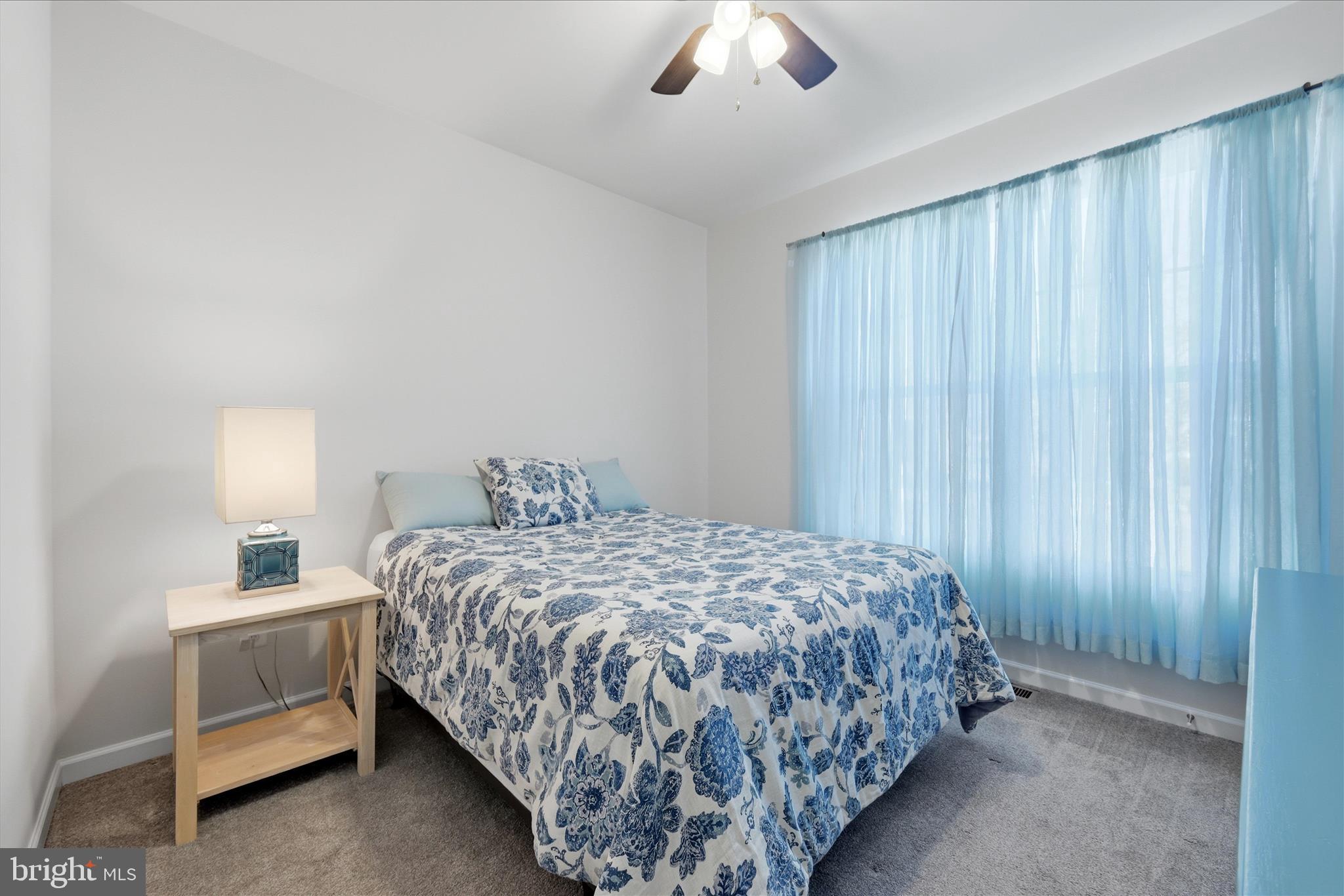 133 Patchwork Drive Stephenson, VA 22656 - Photo 17 of 63 a bedroom with a bed and a chandelier