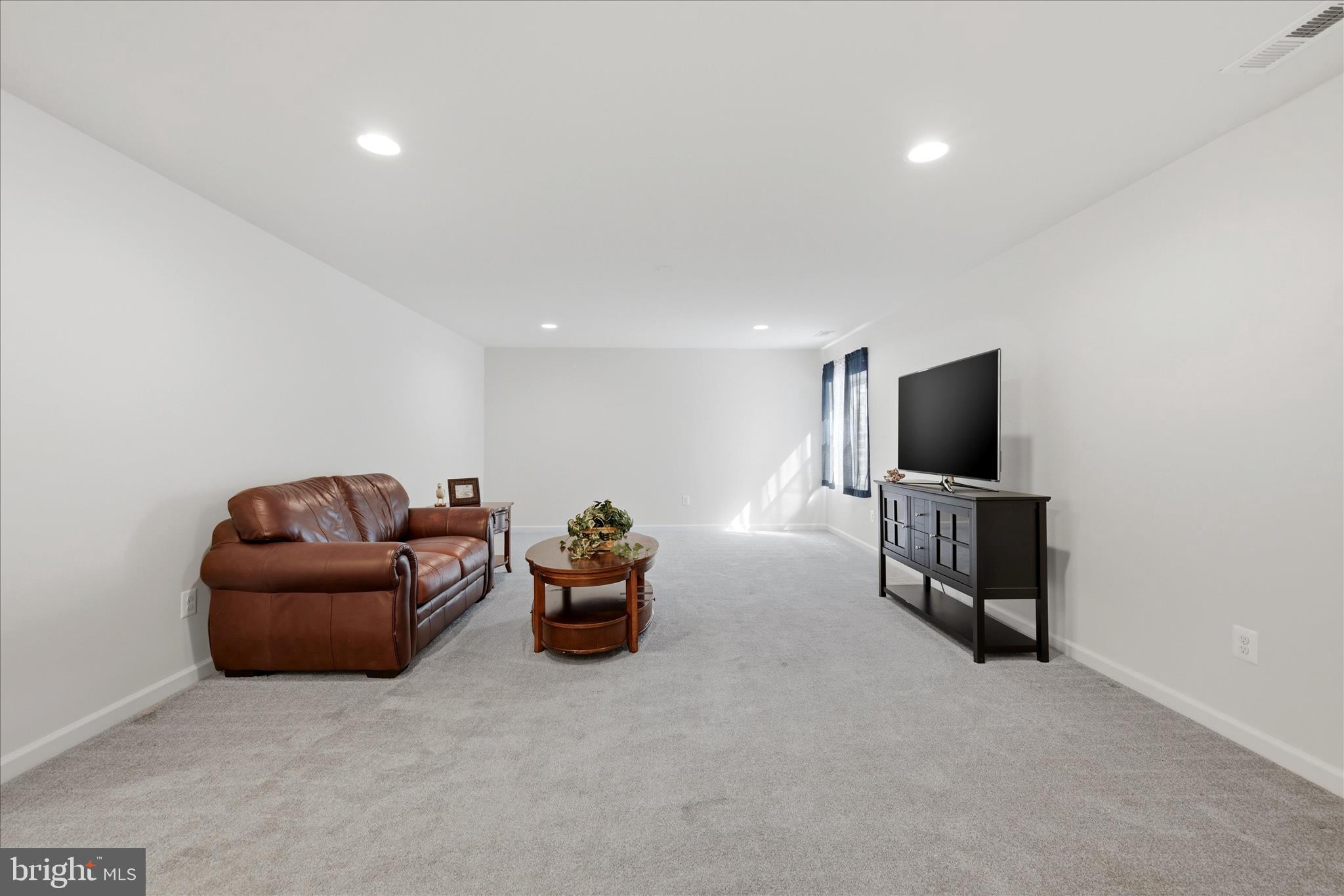 133 Patchwork Drive Stephenson, VA 22656 - Photo 25 of 63 a living room with furniture and a flat screen tv