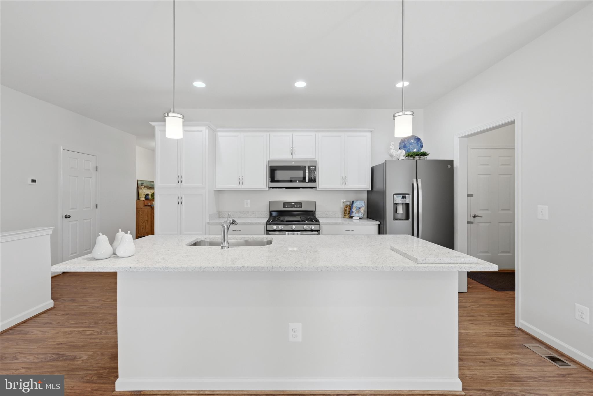 133 Patchwork Drive Stephenson, VA 22656 - Photo 6 of 63 a large kitchen with stainless steel appliances kitchen island a stove a refrigerator a sink a center island and furniture