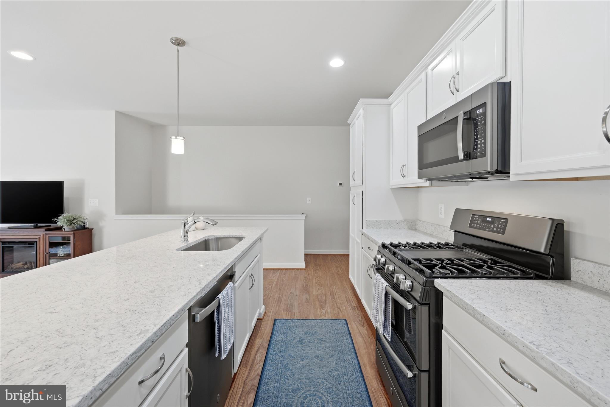 133 Patchwork Drive Stephenson, VA 22656 - Photo 7 of 63 a kitchen with stainless steel appliances stove microwave and cabinets