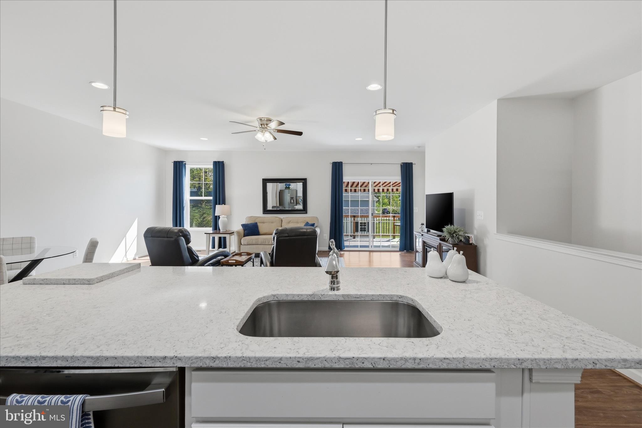 133 Patchwork Drive Stephenson, VA 22656 - Photo 8 of 63 a kitchen with a sink a counter space and living room