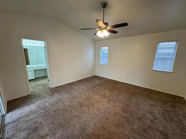 a utility room with cabinets washer and dryer
