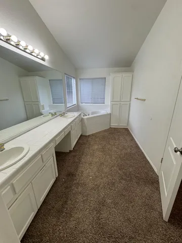 a white toilet sitting next to a window