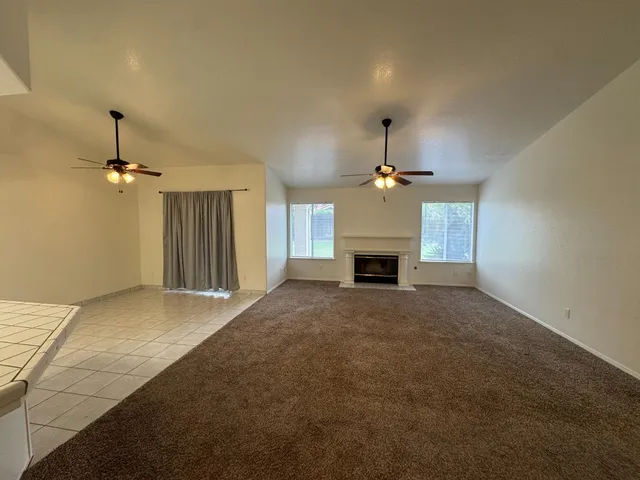 a view of a kitchen with a stove cabinets and a wooden floor