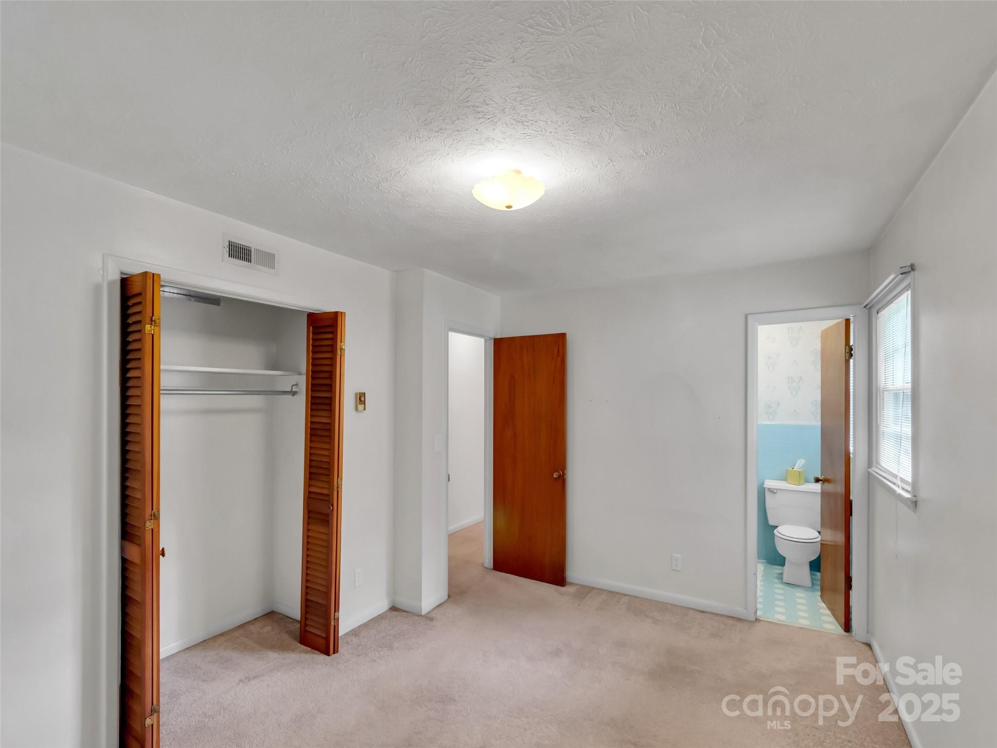 250 Reeves Cove Road Candler, NC 28715 - Photo 17 of 47 a view of an empty room