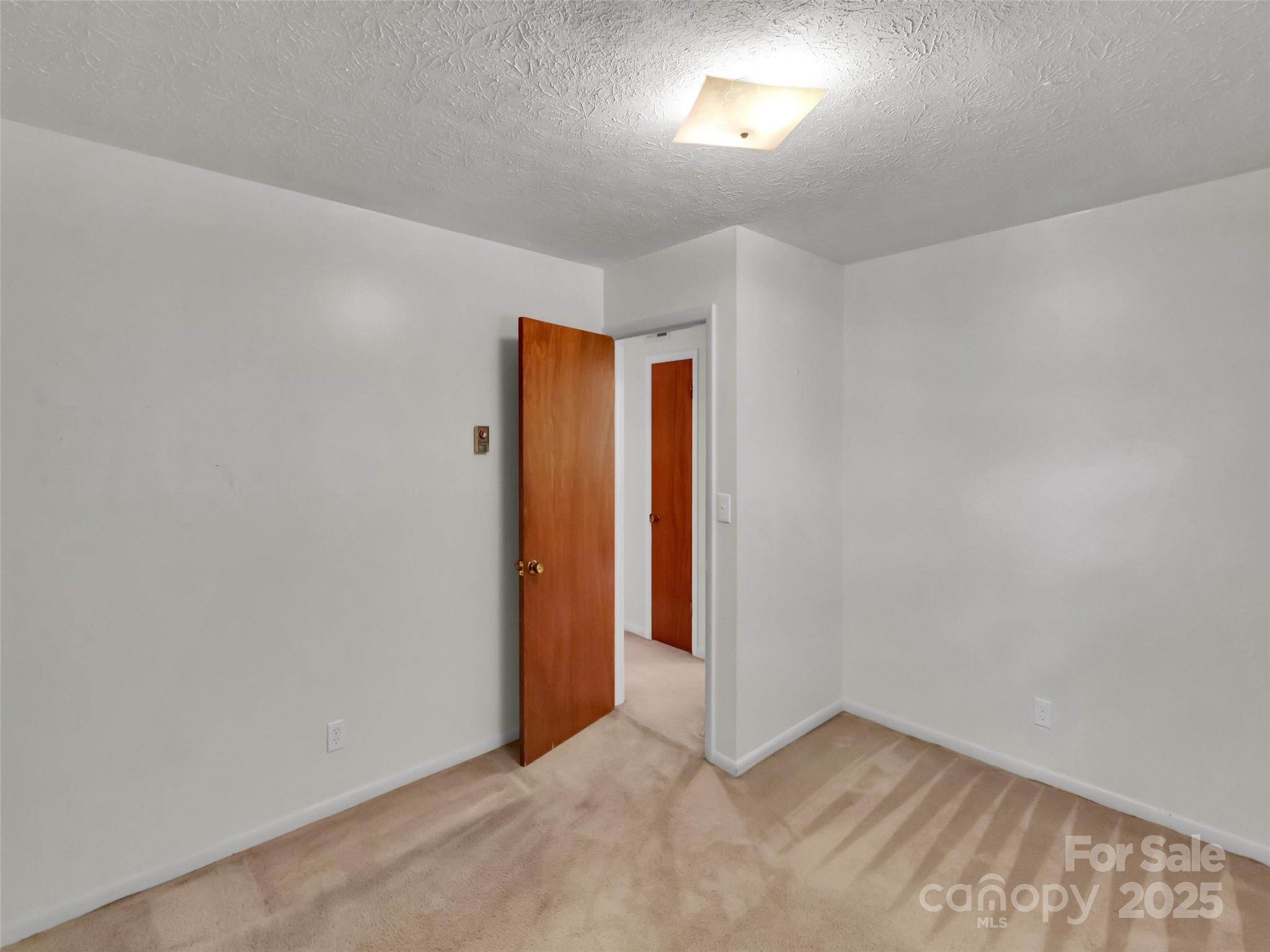 250 Reeves Cove Road Candler, NC 28715 - Photo 22 of 47 a view of an empty room and window