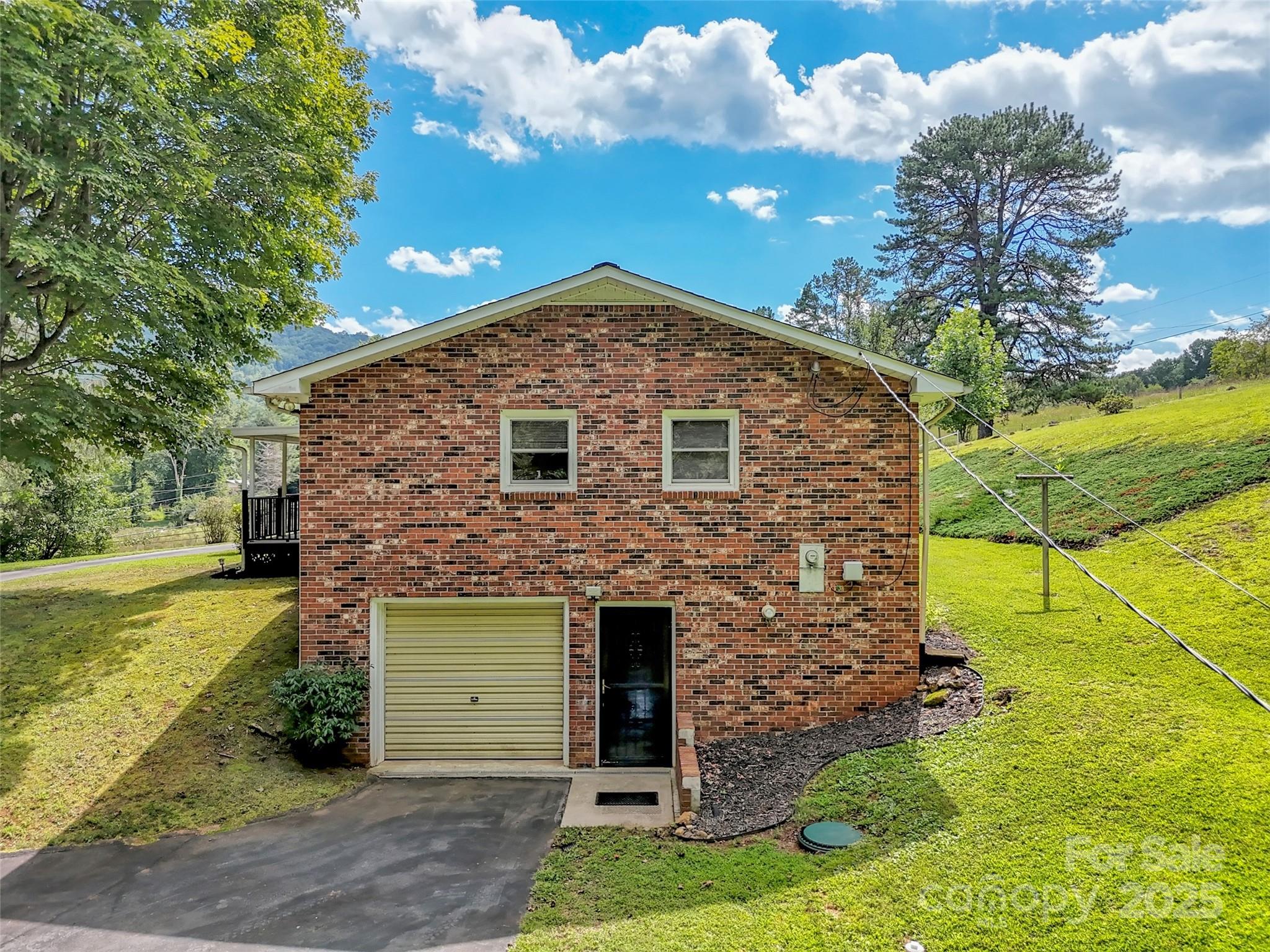 250 Reeves Cove Road Candler, NC 28715 - Photo 36 of 47 a front view of a house with garden