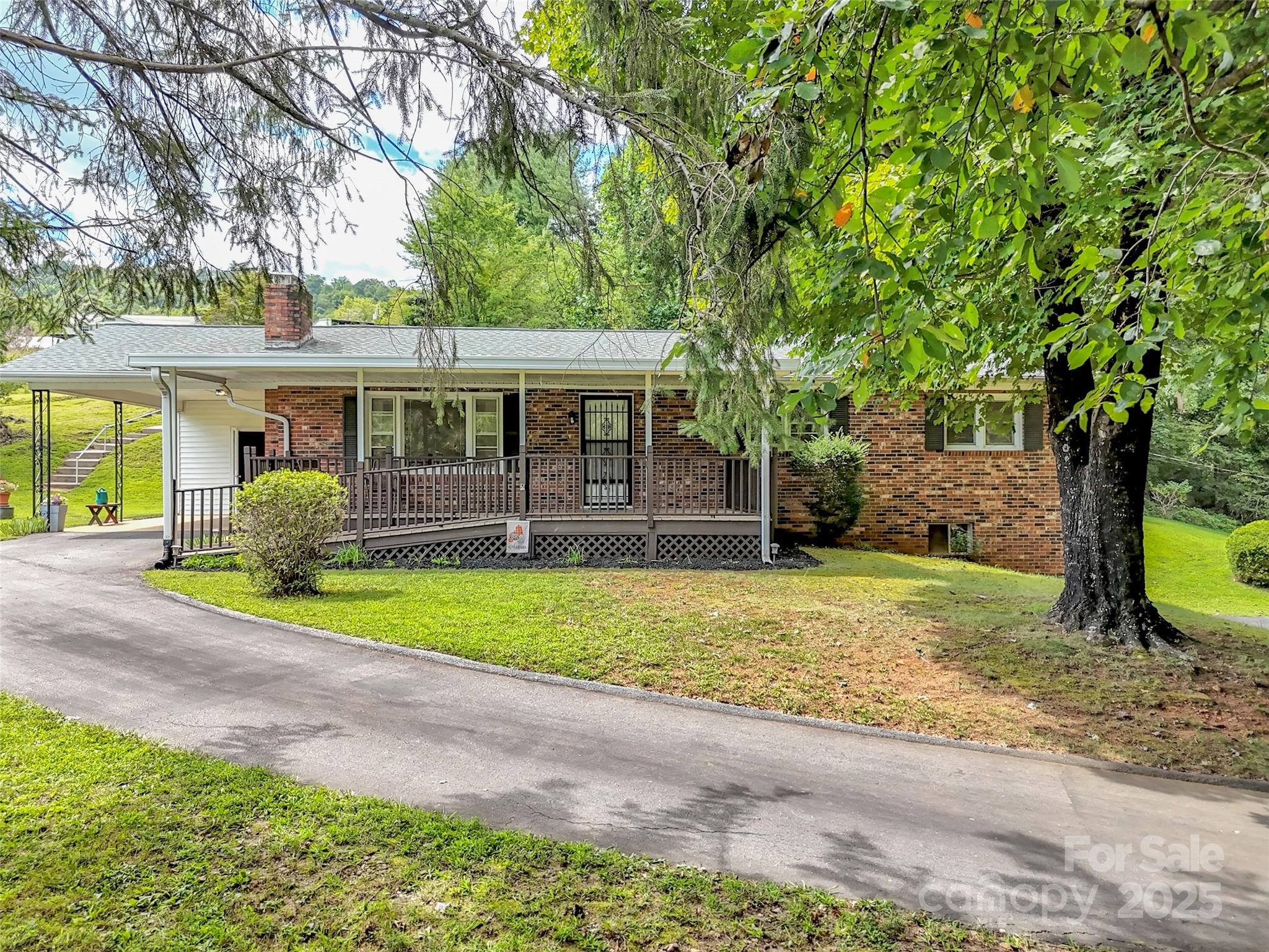 250 Reeves Cove Road Candler, NC 28715 - Photo 40 of 47 a front view of a house with garden