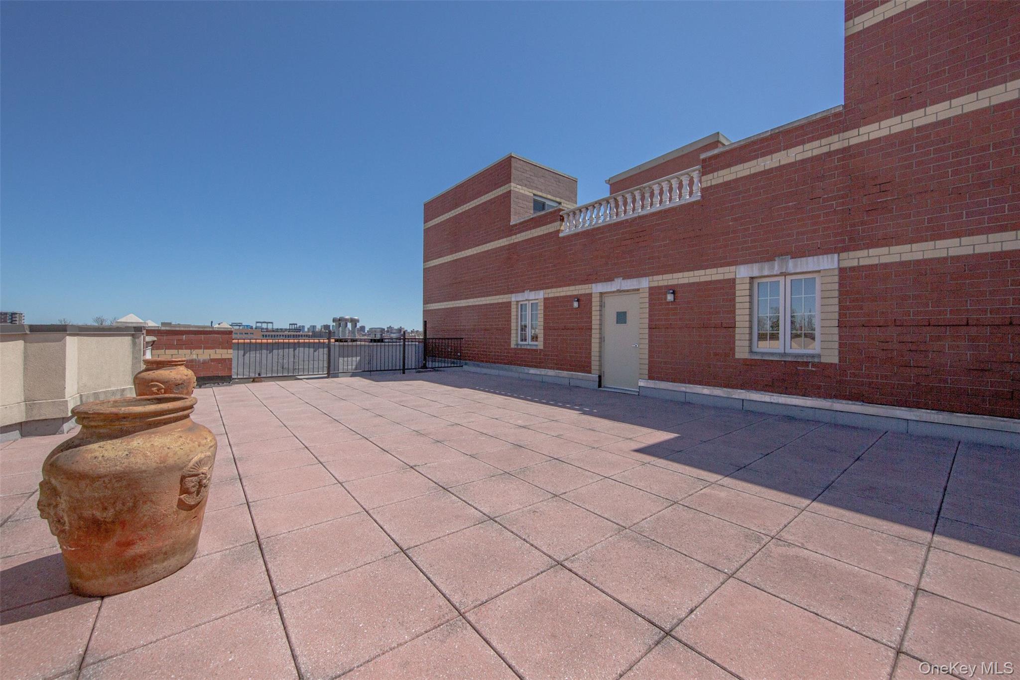 10716 37th Avenue, Unit 3B Queens, NY 11368 - Photo 19 of 19 a view of a terrace with chairs