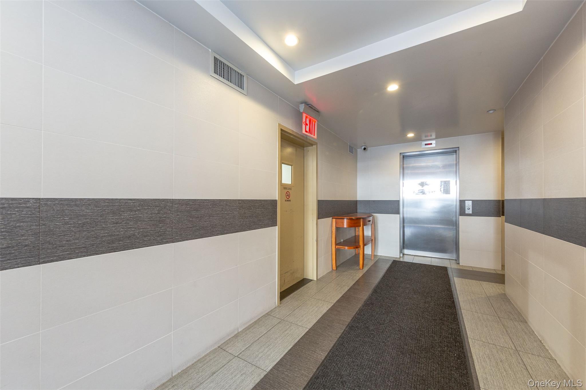 10716 37th Avenue, Unit 3B Queens, NY 11368 - Photo 2 of 19 a view of a kitchen with dining room and wooden floor