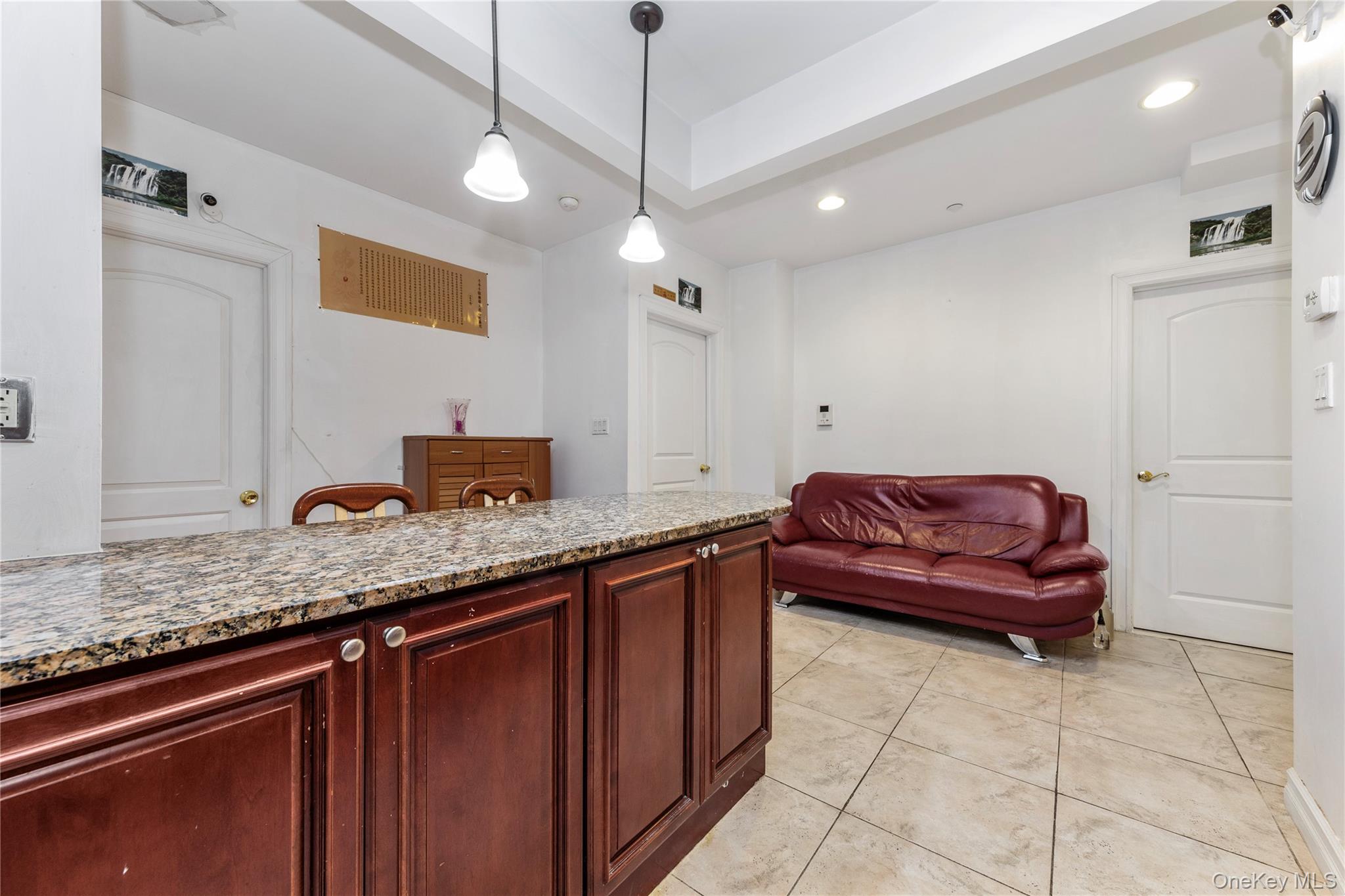 10716 37th Avenue, Unit 3B Queens, NY 11368 - Photo 6 of 19 a kitchen with a sink and a refrigerator