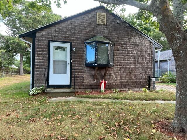 260 Hinckley Road Hyannis, MA 02601 - Photo 4 of 18 a front view of a house with a yard