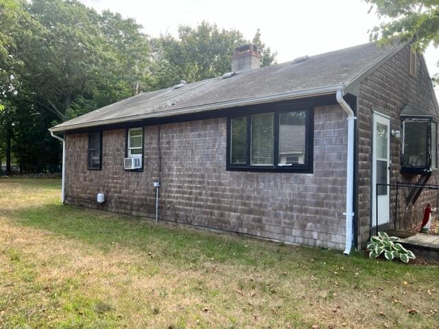 260 Hinckley Road Hyannis, MA 02601 - Photo 5 of 18 a brick house with a small yard