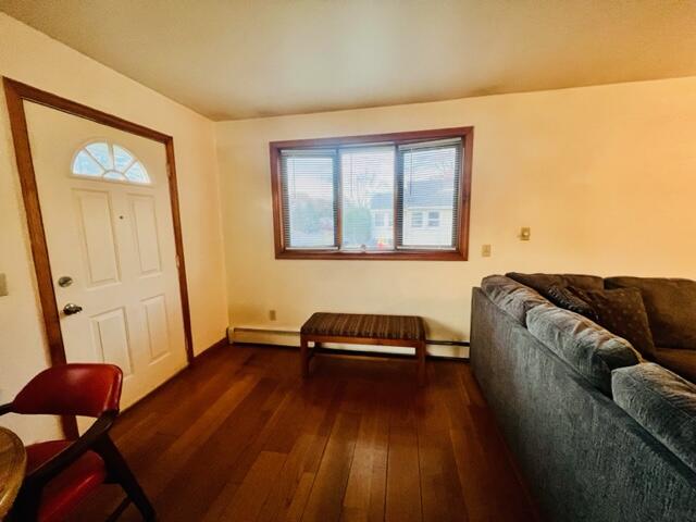 260 Hinckley Road Hyannis, MA 02601 - Photo 6 of 18 a bedroom with a bed and wooden floor