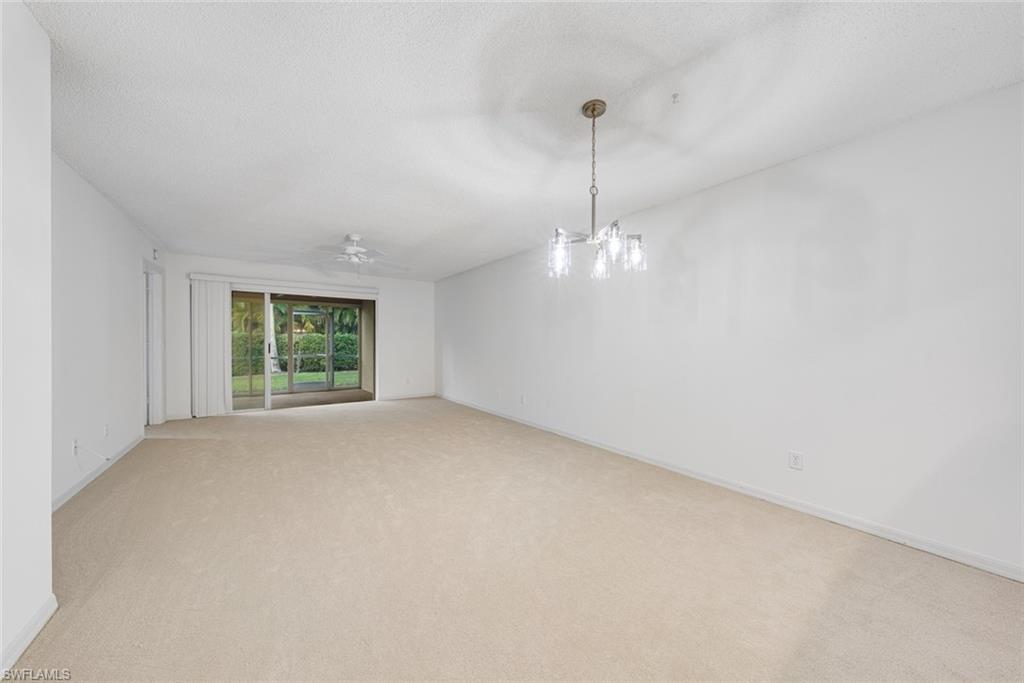 7761 Jewel Lane, Unit 103 Naples, FL 34109 - Photo 5 of 26 a view of an empty room with a window