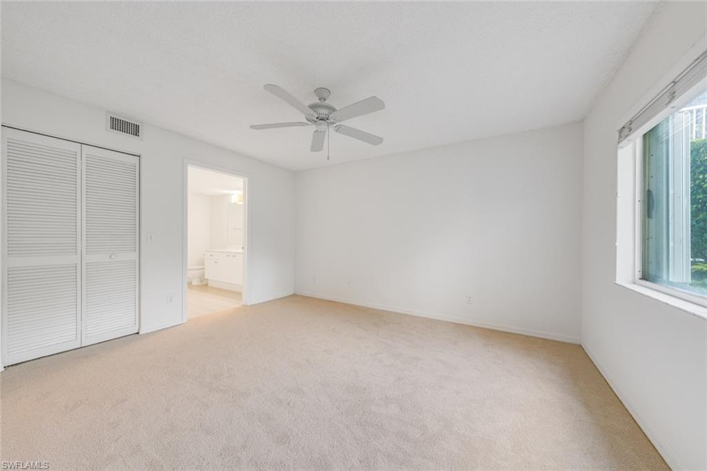 7761 Jewel Lane, Unit 103 Naples, FL 34109 - Photo 6 of 26 a view of an empty room with a window