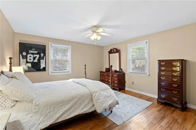 a bed room with a bed and a chandelier