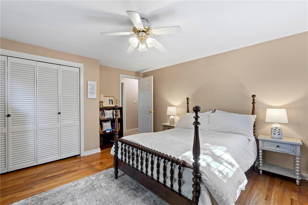 21 Oakglen Drive Oakmont, PA 15139 - Photo 23 of 50 a bed room with a bed and a chandelier