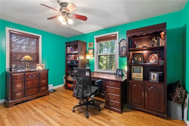 a workspace with furniture and wooden floor