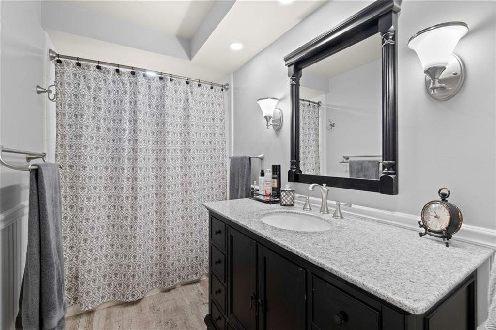 21 Oakglen Drive Oakmont, PA 15139 - Photo 27 of 50 a bathroom with a granite countertop sink and a mirror