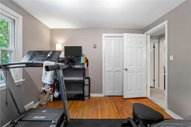 a bedroom with furniture and a window