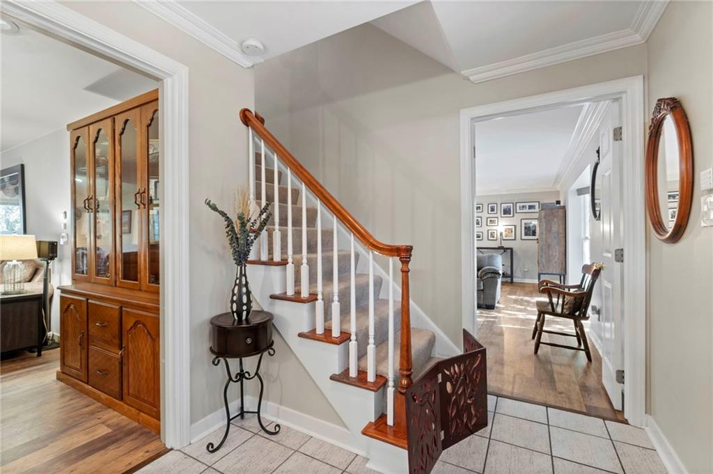 21 Oakglen Drive Oakmont, PA 15139 - Photo 3 of 50 a view of an entryway with wooden floor and windows