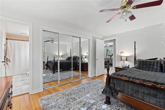 a bed room with furniture and a flat screen tv