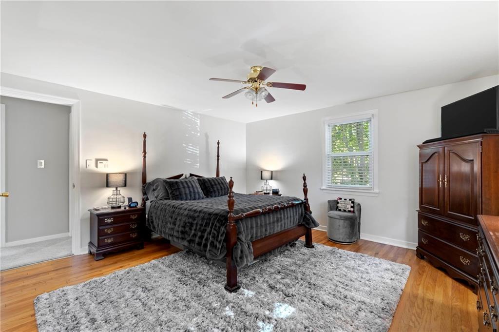 21 Oakglen Drive Oakmont, PA 15139 - Photo 34 of 50 a bed room with furniture and a flat screen tv