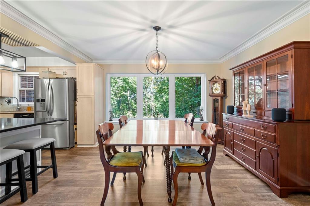 21 Oakglen Drive Oakmont, PA 15139 - Photo 7 of 50 a dining room with furniture a chandelier and wooden floor