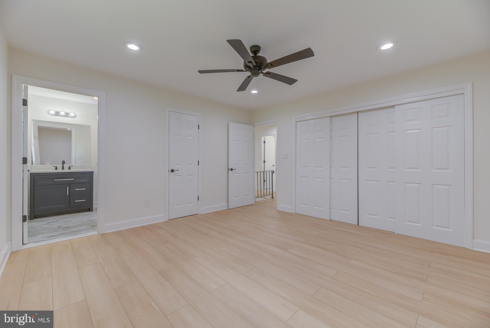 90 Princeton Hightstown Road Princeton Junction, NJ 08550 - Photo 12 of 20 a view of a livingroom with a ceiling fan and wooden floor