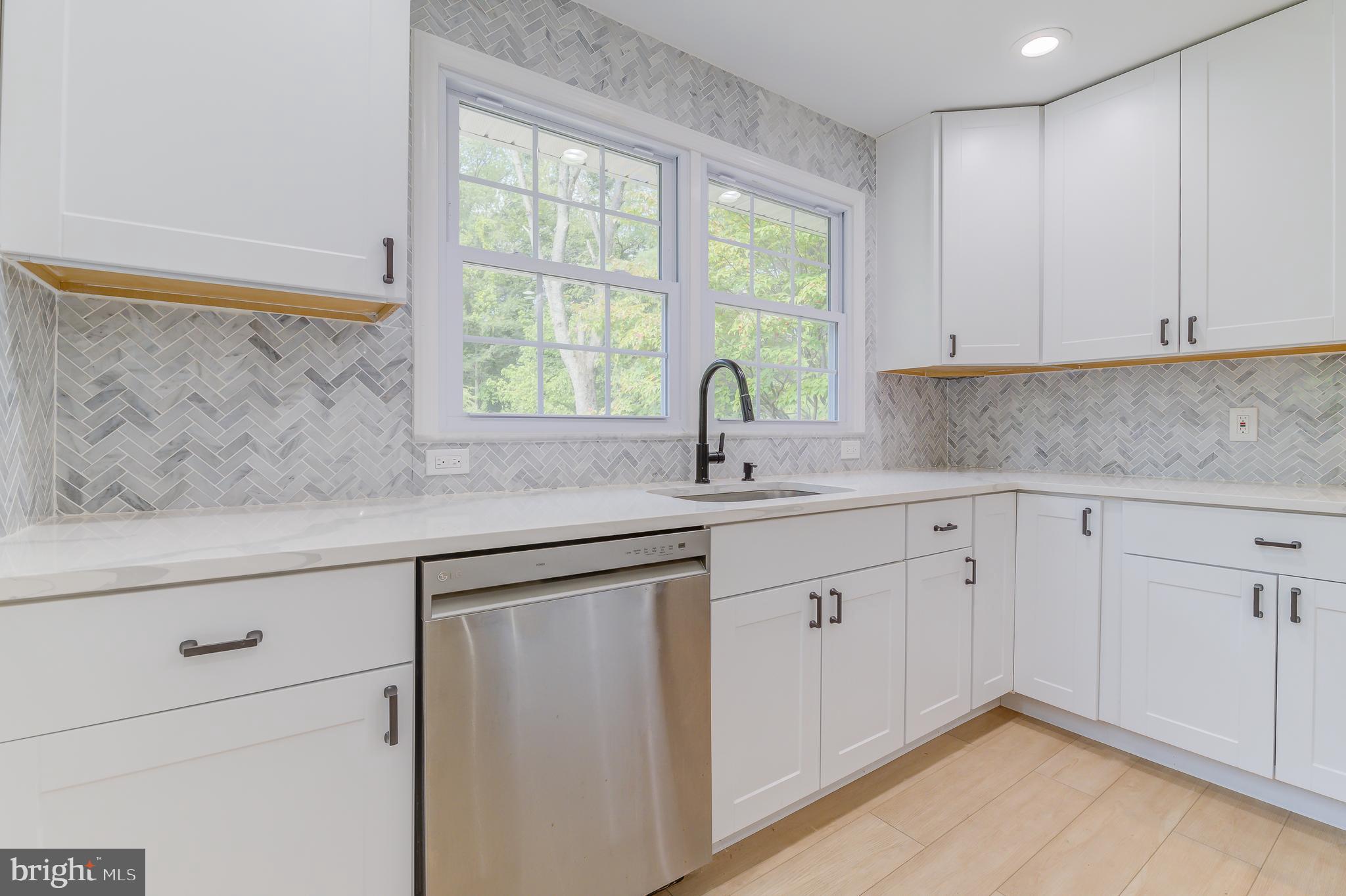 90 Princeton Hightstown Road Princeton Junction, NJ 08550 - Photo 17 of 20 a kitchen with white cabinets and a window