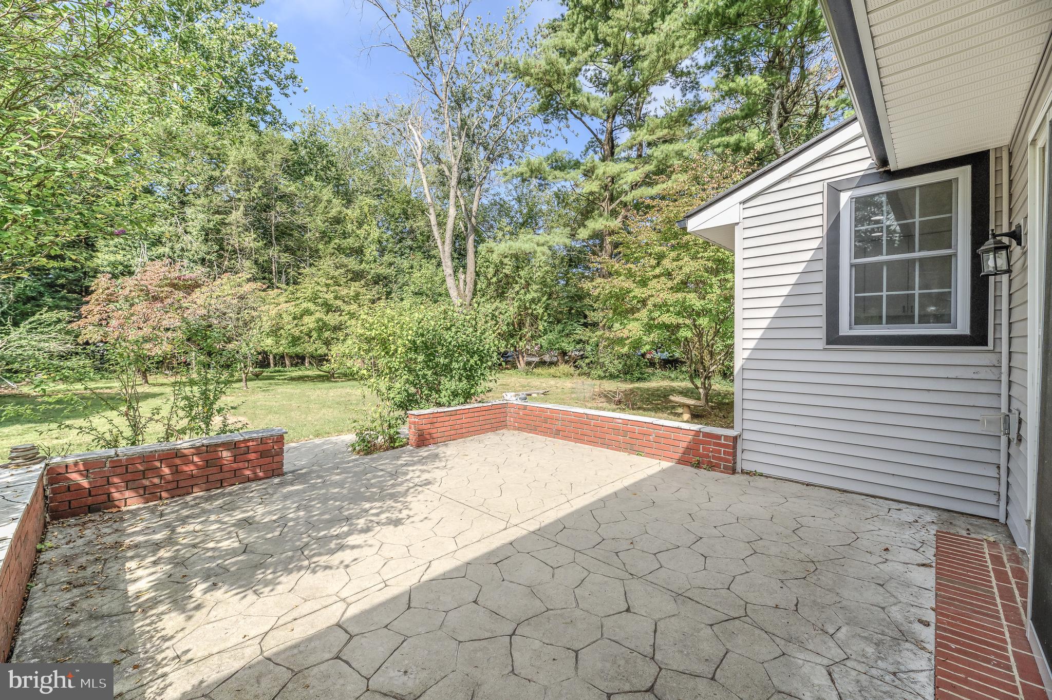 90 Princeton Hightstown Road Princeton Junction, NJ 08550 - Photo 19 of 20 a view of a yard with a house and a yard
