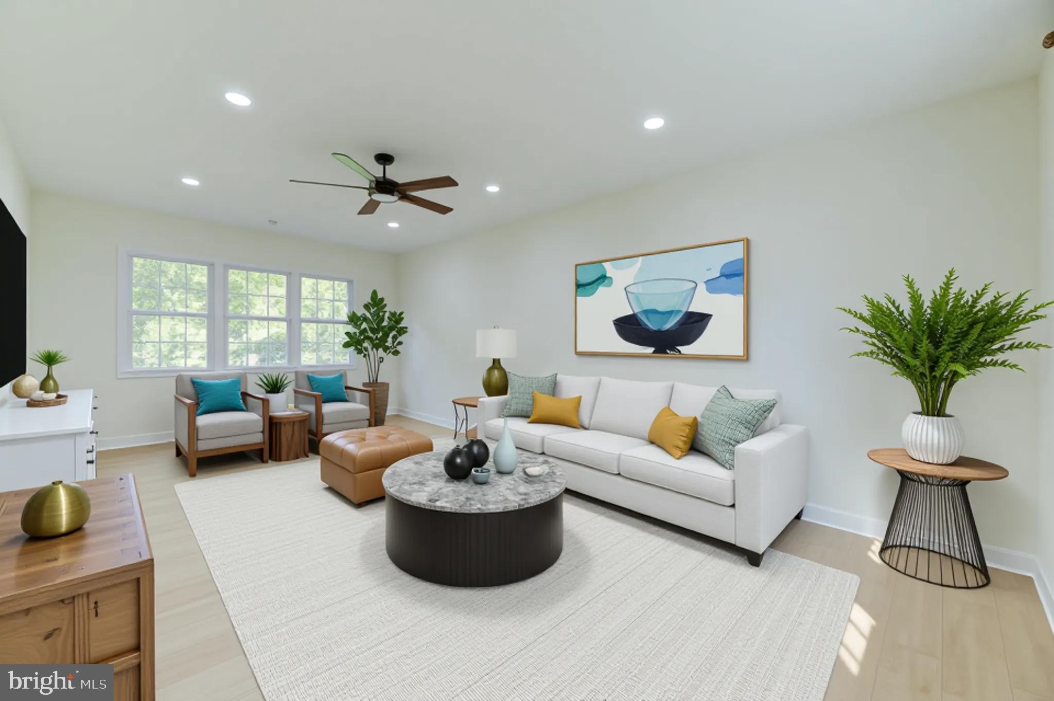 90 Princeton Hightstown Road Princeton Junction, NJ 08550 - Photo 4 of 20 a living room with furniture potted plant and a large window