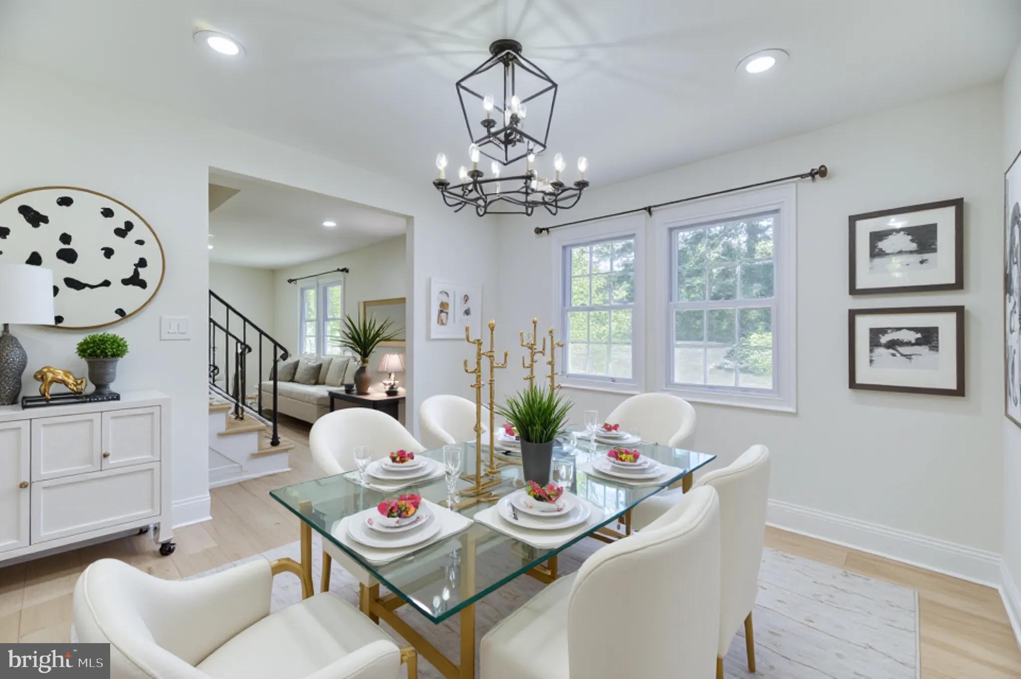 90 Princeton Hightstown Road Princeton Junction, NJ 08550 - Photo 5 of 20 a view of a dining room with furniture a chandelier and wooden floor
