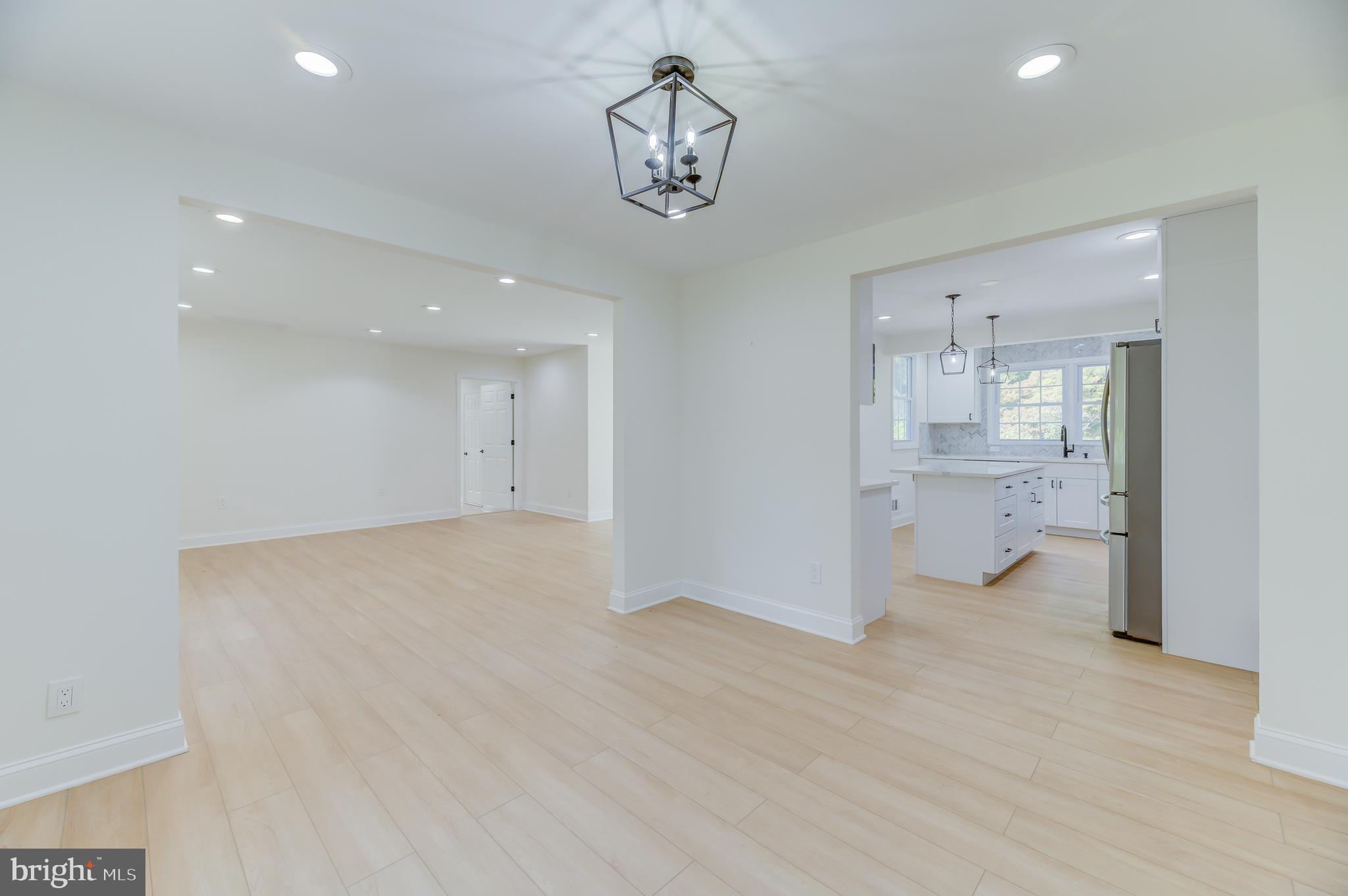 90 Princeton Hightstown Road Princeton Junction, NJ 08550 - Photo 8 of 20 a view of a kitchen with wooden floor and a sink