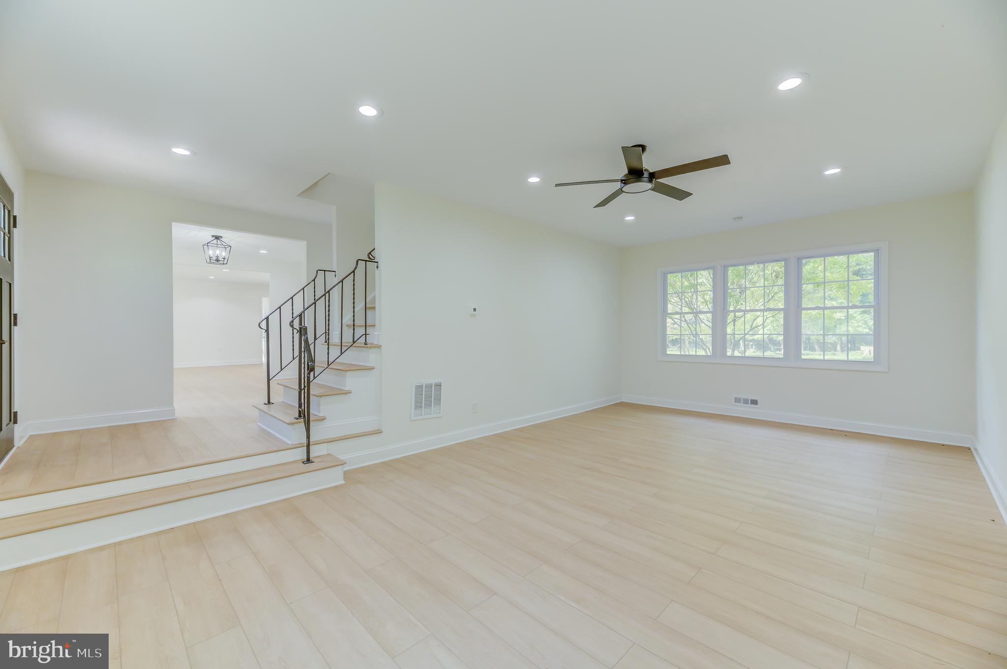 90 Princeton Hightstown Road Princeton Junction, NJ 08550 - Photo 9 of 20 wooden floor in an empty room with a window