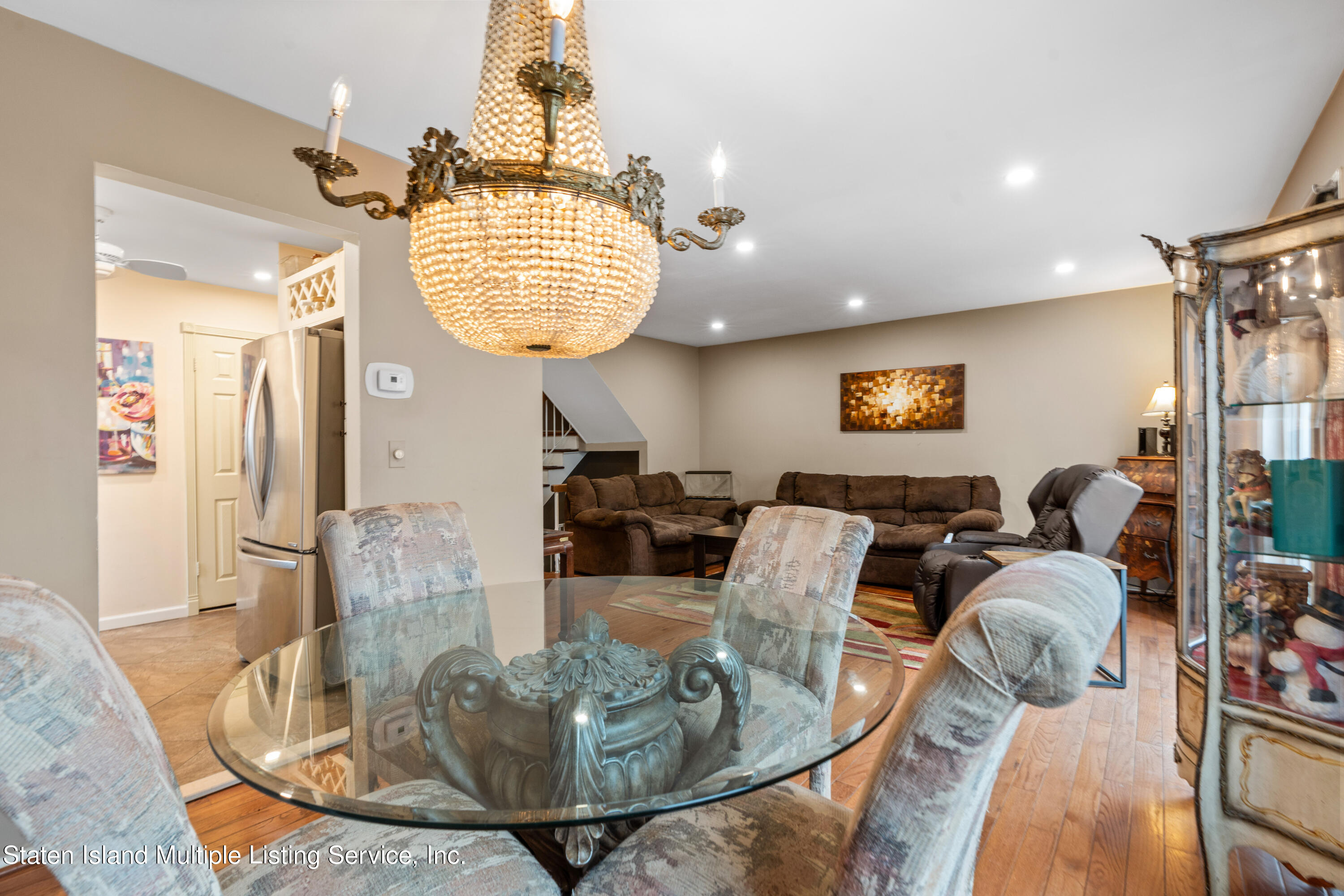 15 Flagship Circle Staten Island, NY 10309 - Photo 19 of 31 a living room with furniture a chandelier and a table
