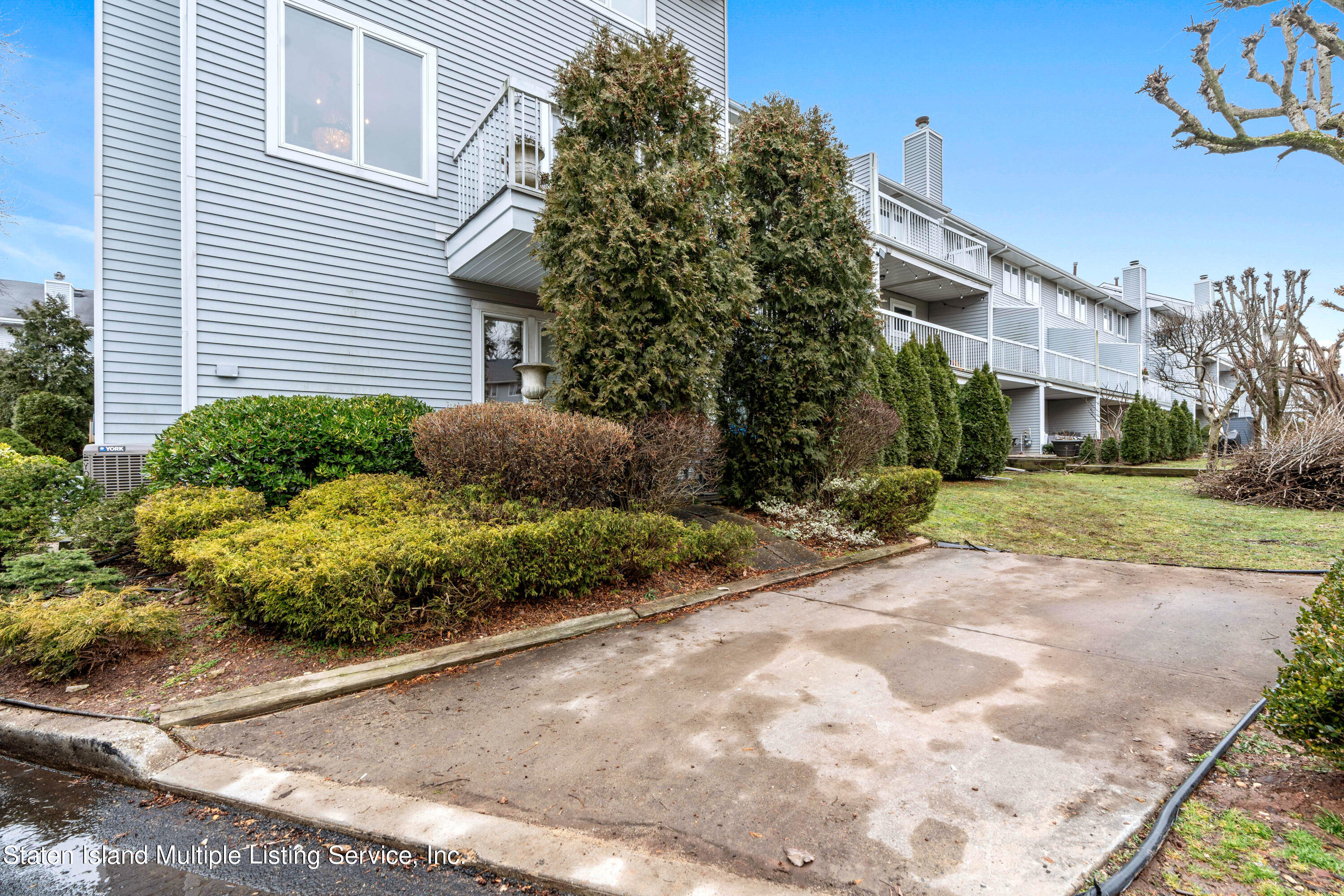 15 Flagship Circle Staten Island, NY 10309 - Photo 31 of 31 a view of a house with a yard and potted plants