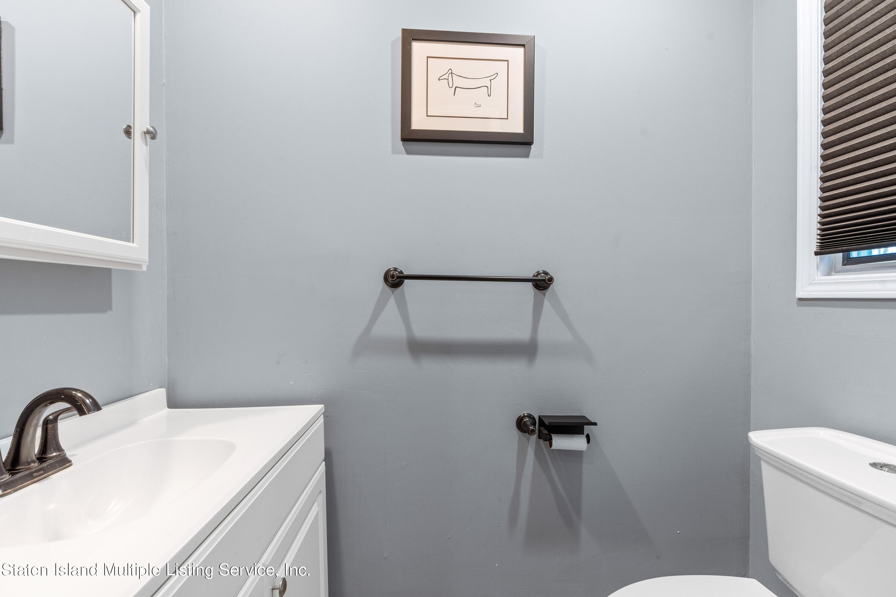 15 Flagship Circle Staten Island, NY 10309 - Photo 10 of 31 a bathroom with a sink a toilet and shower